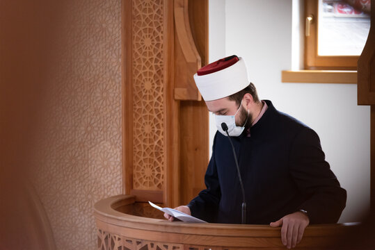 Imam Giving Khutbah from Minbar Inside Mosque Wearing Face Mask