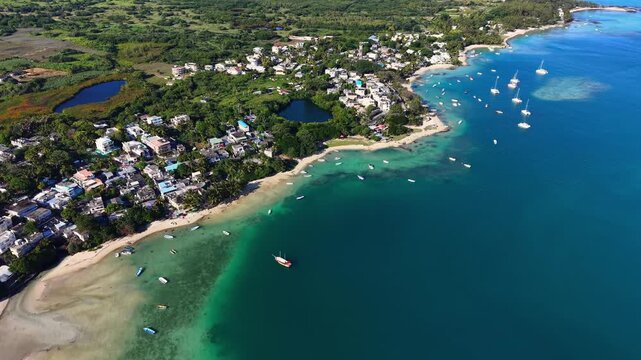 Scenic aerial drone video of the Trou d`Eau Douce resort, Mauritius, Africa. Indian ocean coral reef landscape	