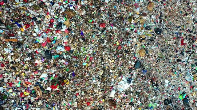 top down aerial view of massive plastic waste landfill