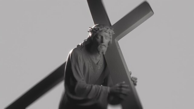 Religious Art Portrait. Solemn White Statue Depicting Jesus Christ Burdened by Cross During Crucifixion Journey. High Contrast Art For Religious and Easter Media. Christian Concept of Via Dolorosa.