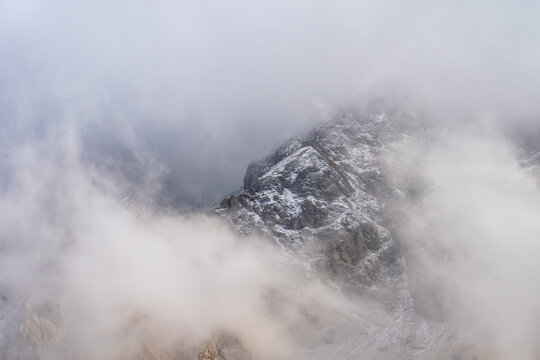 Misty Mountain Peak Covered in Snow