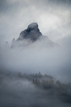 Misty Mountain Peak in Foggy Landscape