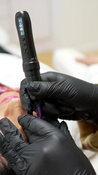 Professional aesthetician performing a rejuvenating microneedling mesotherapy treatment on a mature woman's face, stimulating collagen production for anti aging and skin regeneration