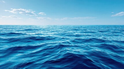 Fototapeta premium Calm and Serene Blue Ocean Waves Under Clear Sky with Gentle Clouds and Horizon, Perfect for Nature and Travel Themes