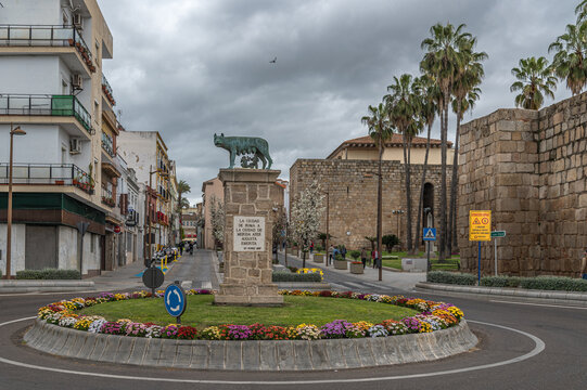 MERIDA, SPAIN - APRIL 1, 2023: View of a roundabout with the Capitoline Wolf (Loba Capitolina) statue, a replica of the Roman she-wolf with Romulus and Remus in Merida, Spain