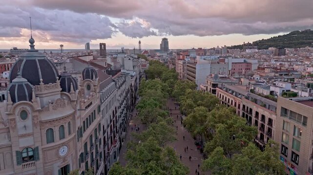 Aerial drone flying over la rambla in barcelona, spain
