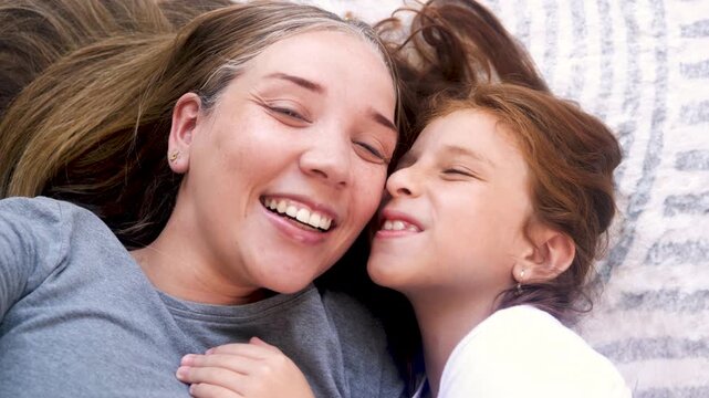 Happy latin mother and little daughter having fun together at home - Mom day and family relationship concept