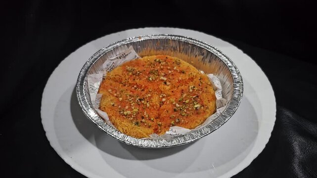 indian curry paste,Kunafeh,Kunafa,Knafeh Kunafi  is popular dessert in Middle east,Arabian,Turkiye,Greece,Balkan and Caucasus.Popular for Ramadan.It served with crushed pistachios and Attar is sweeten