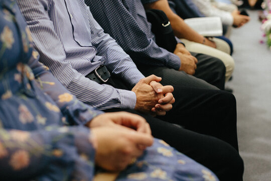 People praying together during a church service