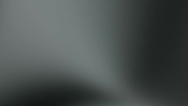 Minimalist black abstract gradient shifting subtly with soft white highlights in a dark studio cinematic void for a moody atmospheric monochromatic style