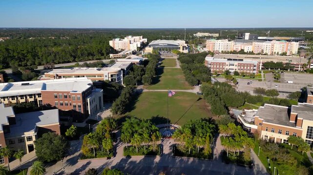 Aerial backwards flight over the University of Central Florida campus green