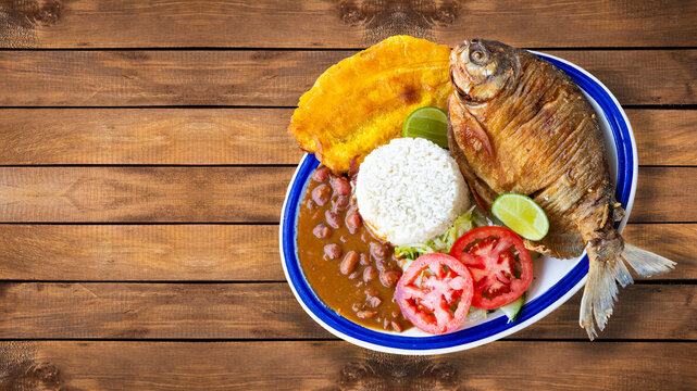 Traditional dish of whole fried fish accompanied by typical Colombian side dishes - Typical Colombian cuisine