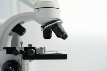 Fototapeta premium Scientist analyze biochemical samples in advanced scientific laboratory. Medical professional use microscope look microbiological developmental of viral. Biotechnology research in science lab.