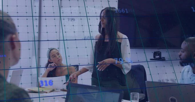 Vertical video: Standing lead speaking, animating tech data grid over laptops in business briefing