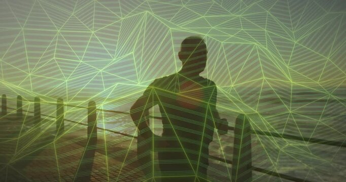 Senior man pacing rail, sun nearing horizon drawing gaze toward sea, wireframe syncing camera tech