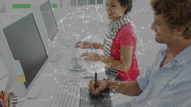 Man sketching tablet, woman typing, session starting showing globe rotating over desk for design