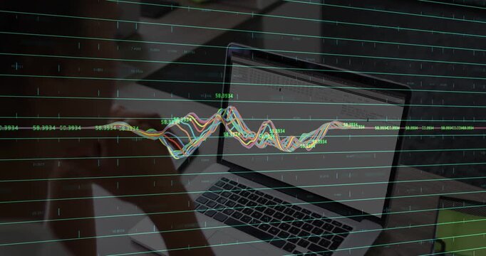 Mid-adult woman leaning at desk and tapping laptop, waveform showing tech data responding to input