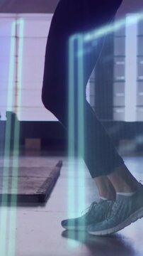 Vertical video: Woman starting shift hopping and using rope for fitness with blue-green overlay