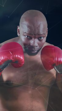 Vertical video: Boxer in guard, red gloves bobbing, jabbing, gauging range, node overlay tracking