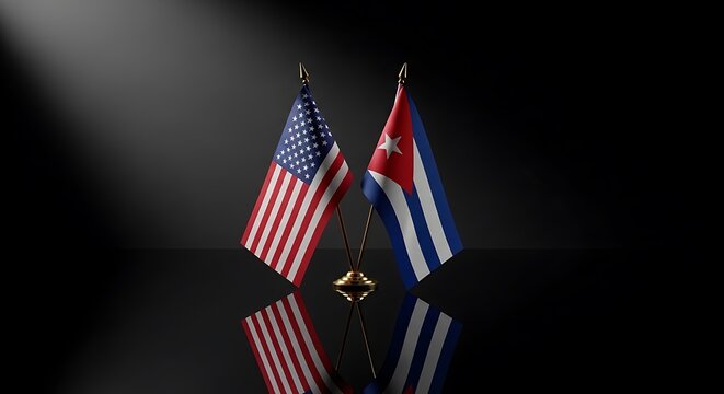 United States and Cuba flags crossed on a reflective surface with dramatic lighting