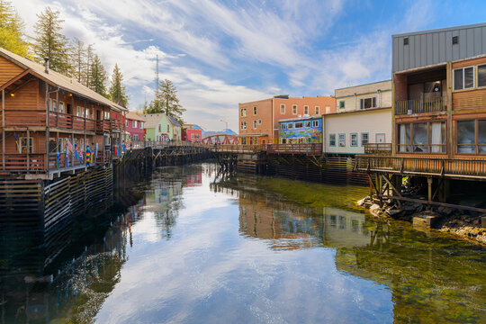 Colorful shops along the touristic waterfront Creek Street in Ketchikan, Alaska, a historic boardwalk built on pilings over Ketchikan Creek, and now a popular cruise ship destination.