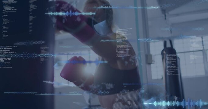 Female boxer punching heavy bag in gym, activating blue HUD metrics for training feedback