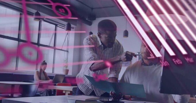 Standing man leaning, pointing at folder; seated man noting business while pink charts hiding view