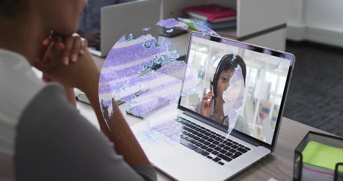 Woman joining business call on laptop, hologram forming, obscuring then revealing onscreen speaker