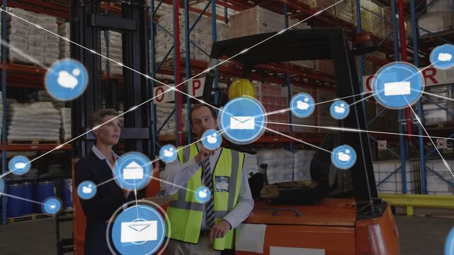 Two coworkers in depot checking docs, blue envelope appearing, icons overlaying scene mapping stock