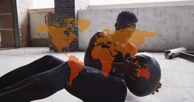 Starting, man rotating torso for core in loft cradling medicine ball wearing black tank orange map