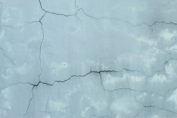 Obraz premium Cracked and damaged concrete wall texture. Abstract background of old weathered cement wall.
