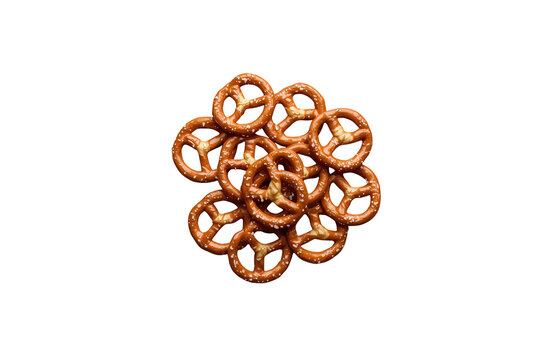 Pile of baked hard pretzels with salt kernels, creating a crunchy, salty snack on a transparent background