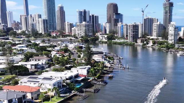 Aerial View of Gold Coast Skyline and Canal with Boat Wake