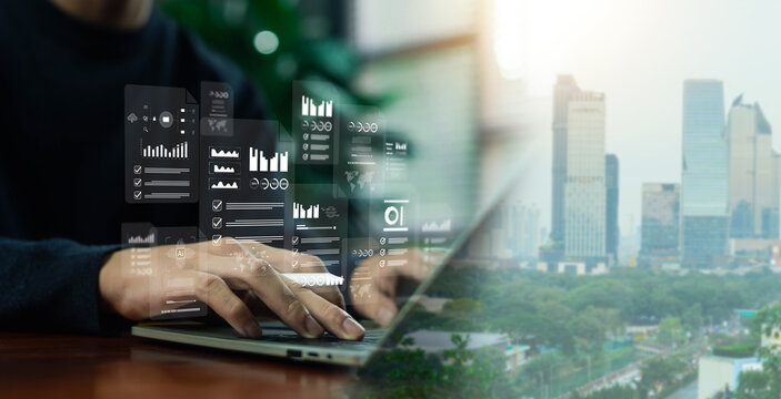 Business professional working on laptop with virtual data analytics dashboard, AI interface, and financial charts over modern city skyline, representing digital transformation, smart technology.