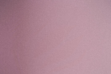 Fototapeta premium Pastel pink glitter surface background with even, fine sparkle, creating a soft romantic mood ideal for feminine branding, party stationery, and stylish digital layouts.