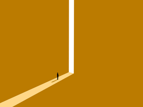 businessman peered through the narrow doorway through which light streamed in