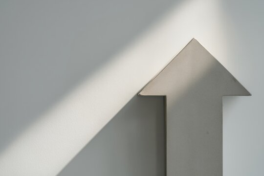 Broken upward arrow symbolizing economic decline and failed growth