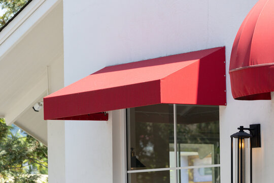 Vibrant red awning shades storefront window