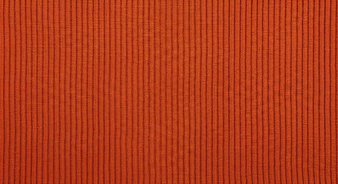A close-up view of an orange fabric with a ribbed texture