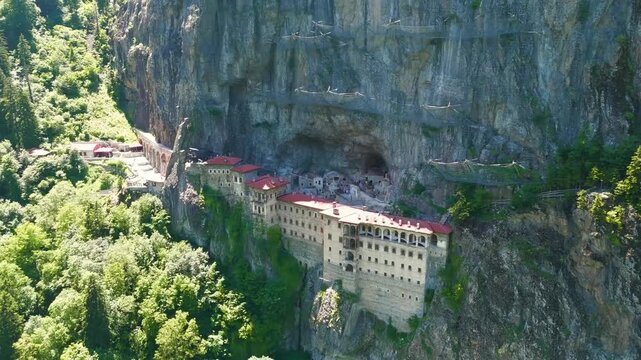 Altindere, Trabzon Province, Turkey. Sumela Monastery. Altindere Valley Park. Coniferous forest on the slopes. Aerial View, MasterShots, Spiral forward, Rocket