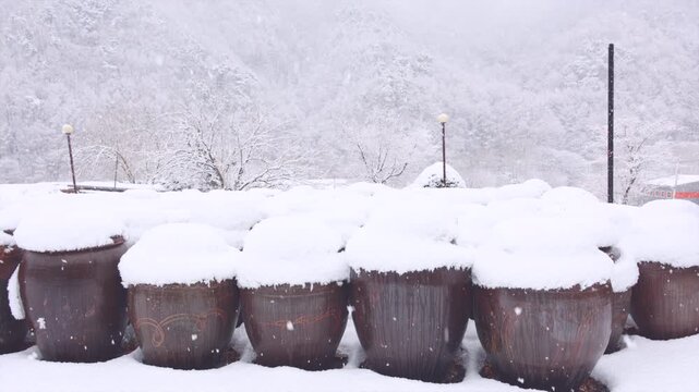 Snow Covered Korean Onggi Jars in Heavy Winter Snowfall