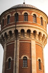 Obraz premium Historical Red Brick Water Tower with Dome