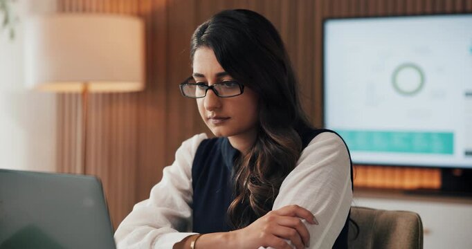 Businesswoman, glasses and research with laptop, office and financial forecasting on web and review. Business analyst, eyewear and person with technology for investment proposal, serious and reading