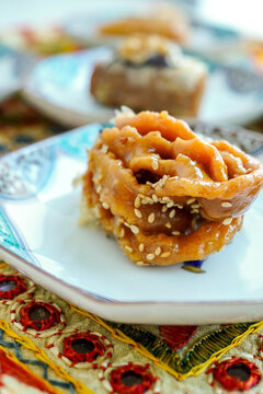 Ramadan sweets: Moroccan Chebakia pastry served on a decorative Arabic tablecloth