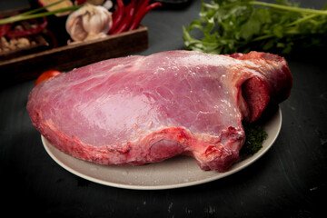 Fototapeta premium Fresh Raw Beef Cut Ready for Cooking with Vegetables on Kitchen Counter