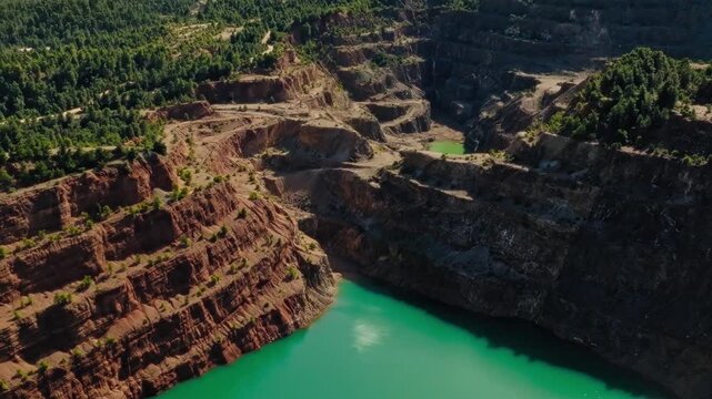Turquoise quarry lake aerial drone view Evia Greece mining landscape