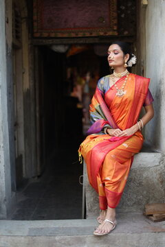 An Indian young woman in a traditional Marathi attire on a Hindu festival. 