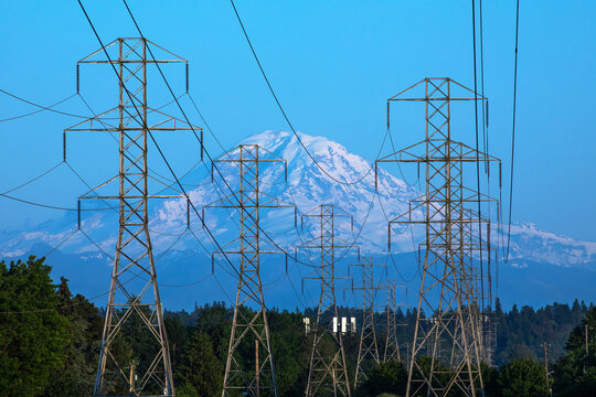 Electrical transmission lines towering above Mount Rainier in Seattle, Wash.