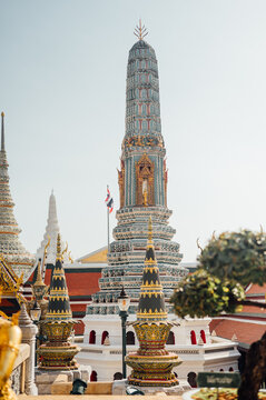 Ornate prang tower and temple structures at Grand Palace Bangkok