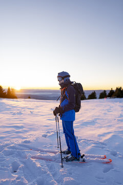 Portrait of a skier at sunrise in the Alps